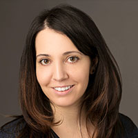 portrait of a smiling young woman with shoulder long brown hair